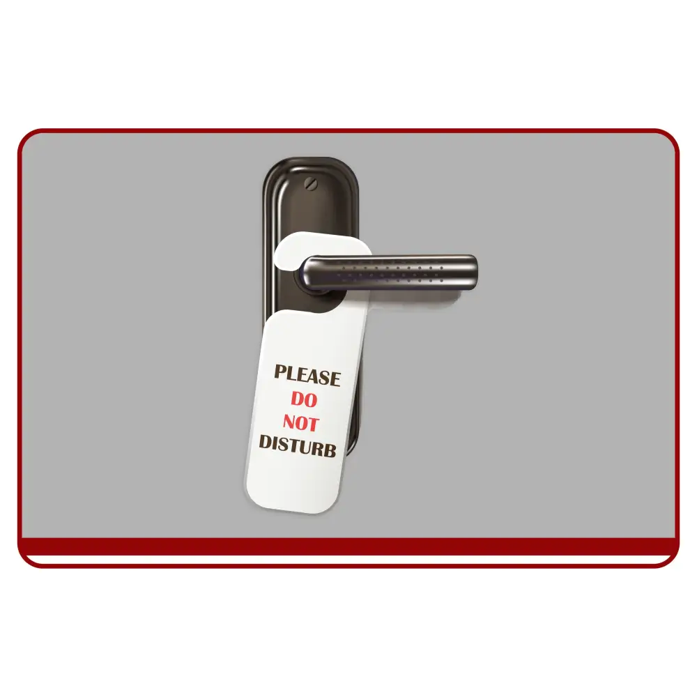 Door handle with a 'Please Do Not Disturb' sign on a gray background
