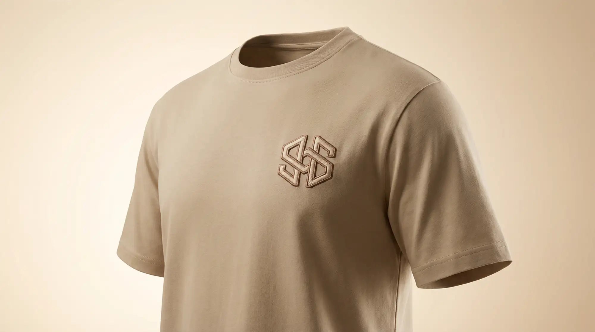 Beige short-sleeved t-shirt with a subtle embroidered logo on the chest.