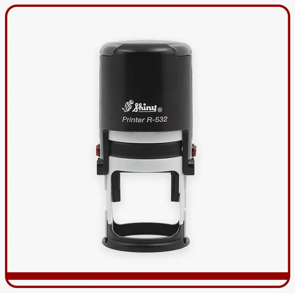 Black and silver shiny printer r-532 self-inking stamp with a sleek, cylindrical design.