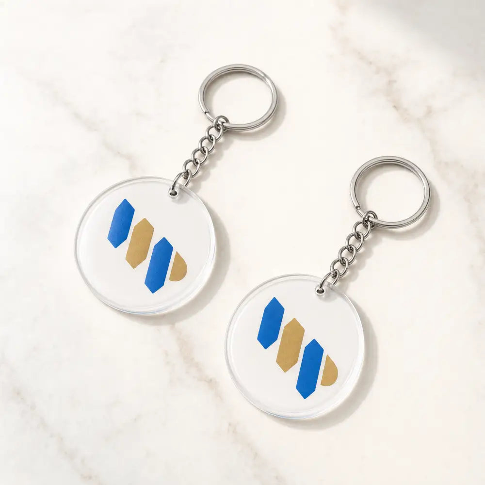 Two keychains with a geometric design on a white background