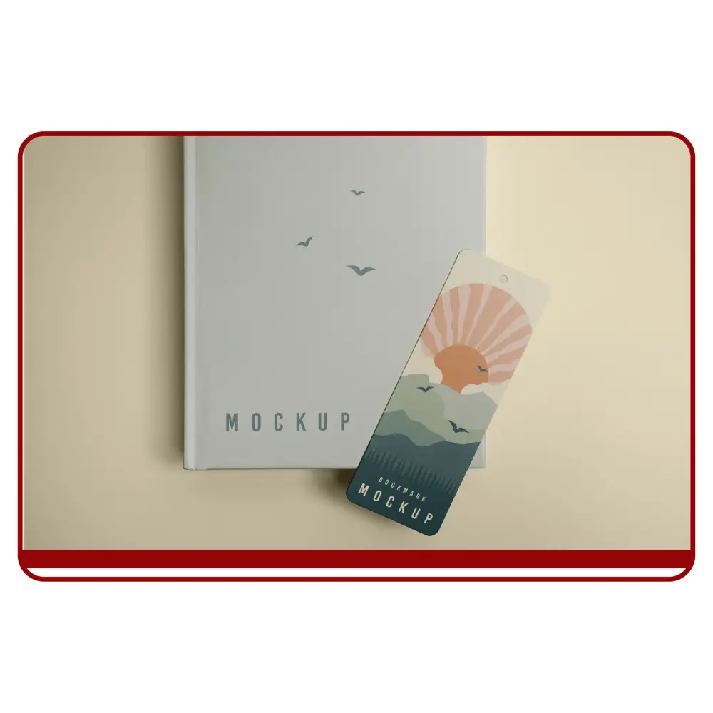 Notebook with a bookmark featuring a sunset design on a beige surface