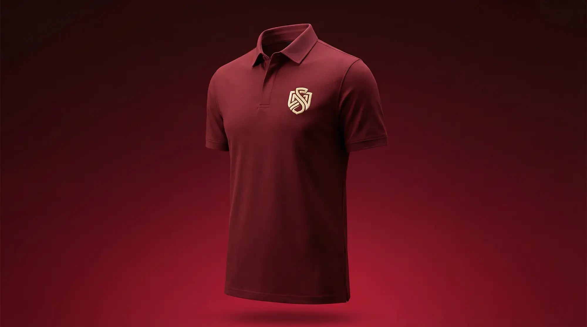 Maroon polo shirt with a gold embroidered logo on the left chest.