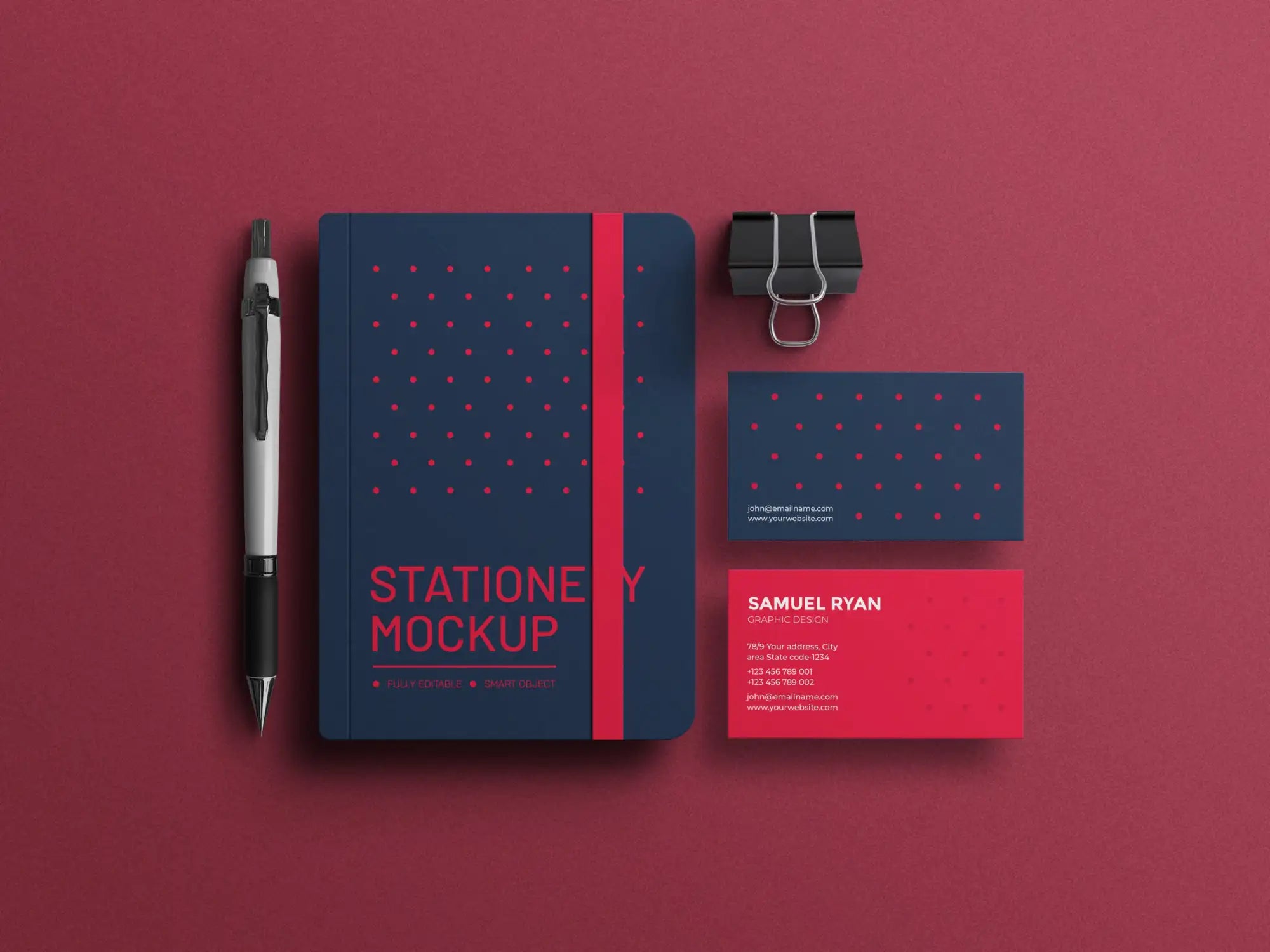 Navy blue and red stationery set with geometric pattern, pen included.