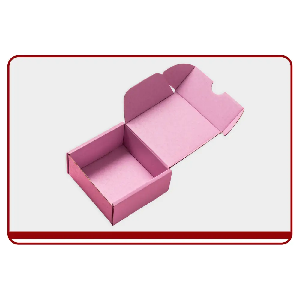 Pink box with 'Pack with Love' and 'Thanks' text held by hands on a beige background