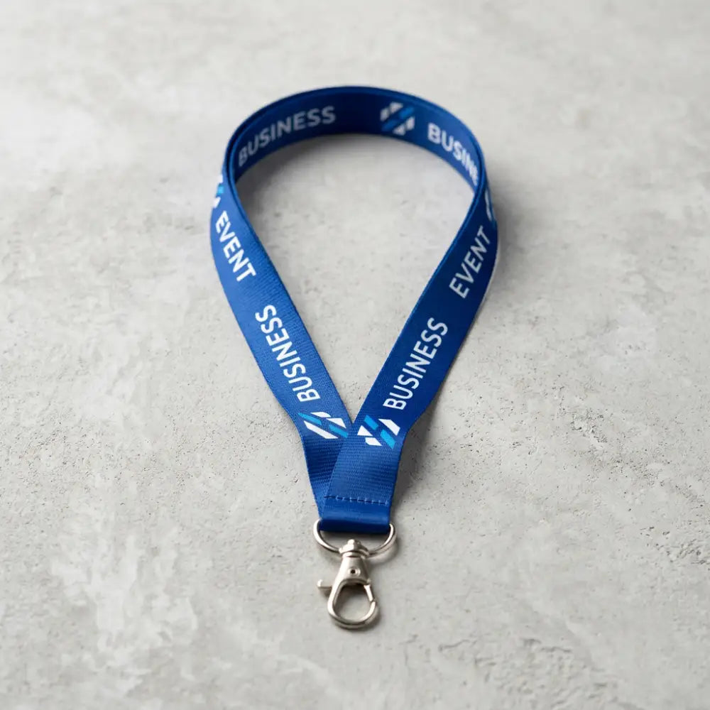 Blue lanyard with 'Business Event' text on a gray surface
