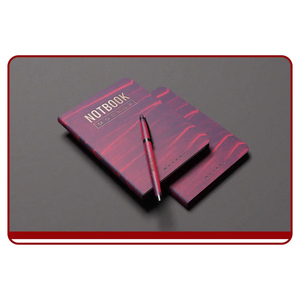 Red notebook and pen set on a gray background