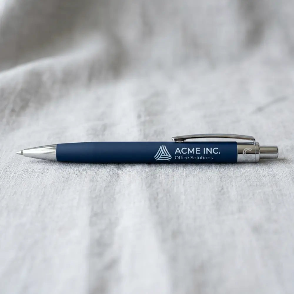 Blue pen with silver accents on a gray fabric background, featuring the 'ACME INC. Office Solutions' logo.