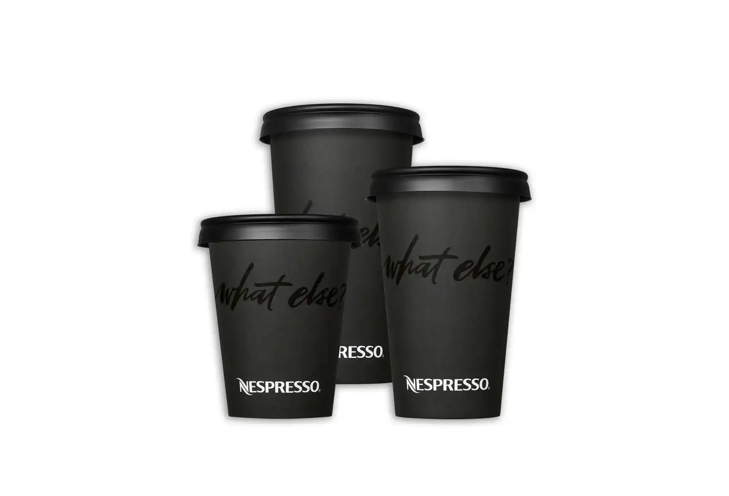 Three black Nespresso coffee cups with lids.